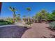 Spacious yard with gravel landscaping, paved walkway, and beautiful pergola perfect for outdoor relaxation at 8370 Unicorn St, Las Vegas, NV 89131
