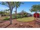 Expansive backyard featuring desert landscaping, green lawn, and mature trees, perfect for outdoor living at 8370 Unicorn St, Las Vegas, NV 89131