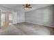 Neutral bedroom featuring large windows and multiple doorways at 8370 Unicorn St, Las Vegas, NV 89131