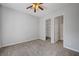 Spacious bedroom featuring neutral walls, carpet flooring, and a ceiling fan at 8370 Unicorn St, Las Vegas, NV 89131