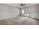 Spacious bedroom with large windows and a ceiling fan at 8370 Unicorn St, Las Vegas, NV 89131