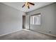Cozy carpeted bedroom offers ample natural light and a connected bathroom at 8370 Unicorn St, Las Vegas, NV 89131