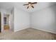 Bedroom with carpet flooring, ceiling fan, and access to other rooms at 8370 Unicorn St, Las Vegas, NV 89131