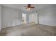 Neutral bedroom with large windows and ensuite bathroom access at 8370 Unicorn St, Las Vegas, NV 89131