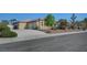 Charming single-story home featuring a spacious driveway, desert landscaping, and a two-car garage at 8370 Unicorn St, Las Vegas, NV 89131