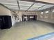 Spacious three-car garage with plenty of storage, shelving, and epoxy flooring at 8370 Unicorn St, Las Vegas, NV 89131