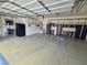 Clean three-car garage with ample storage cabinets, shelving, and epoxy floors at 8370 Unicorn St, Las Vegas, NV 89131