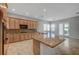 Spacious kitchen with granite countertops, an island, and light wood cabinets at 8370 Unicorn St, Las Vegas, NV 89131