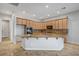 Bright kitchen featuring a large island, granite countertops, and stainless steel appliances at 8370 Unicorn St, Las Vegas, NV 89131