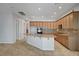 Gourmet kitchen featuring wood cabinets and granite counters with an island and recessed lights at 8370 Unicorn St, Las Vegas, NV 89131