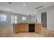 Kitchen island featuring a dishwasher and sink set against a backdrop of a sliding glass door at 8370 Unicorn St, Las Vegas, NV 89131
