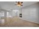 Cozy living room featuring tile flooring, a fireplace, and views of connecting rooms at 8370 Unicorn St, Las Vegas, NV 89131