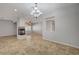 Bright living area showcasing tile flooring, a fireplace, and modern lighting fixtures at 8370 Unicorn St, Las Vegas, NV 89131