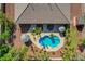 Backyard oasis featuring a freeform pool, a desert landscape, mature trees and cabana at 8370 Unicorn St, Las Vegas, NV 89131