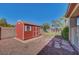 Backyard shed provides extra storage with gravel and stone landscaping at 8370 Unicorn St, Las Vegas, NV 89131