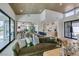 Spacious living room featuring hardwood floors, an open floor plan, and natural light with views into the backyard at 9425 Villa Ridge Dr, Las Vegas, NV 89134