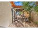 Inviting backyard area with a pergola, outdoor seating, and decorative palm tree, perfect for relaxing outdoors at 9557 Cabot Falls Ave, Las Vegas, NV 89149