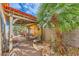 Relaxing backyard with desert landscaping, covered patio and outdoor seating, perfect for enjoying the outdoors at 9557 Cabot Falls Ave, Las Vegas, NV 89149