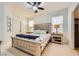 Bedroom featuring a ceiling fan, a light blue paint scheme, and a comfortable king-sized bed at 9557 Cabot Falls Ave, Las Vegas, NV 89149