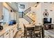 Bright dining area featuring modern decor, wood floors, a stairway and white cabinetry at 9557 Cabot Falls Ave, Las Vegas, NV 89149