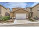 Charming home with a spacious driveway, a two-car garage, desert landscaping and a tile roof at 9557 Cabot Falls Ave, Las Vegas, NV 89149