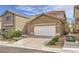 Charming home with a spacious driveway, a two-car garage, desert landscaping and a tile roof at 9557 Cabot Falls Ave, Las Vegas, NV 89149