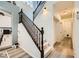 Hallway with a staircase and wood flooring, providing a warm and inviting transition between spaces at 9557 Cabot Falls Ave, Las Vegas, NV 89149