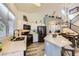Bright kitchen featuring modern appliances, counter space, a dining table and wood floors at 9557 Cabot Falls Ave, Las Vegas, NV 89149