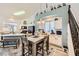 A well-lit kitchen area with lots of counter space, an island, and a dining table at 9557 Cabot Falls Ave, Las Vegas, NV 89149
