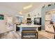 Bright kitchen with white cabinets, stainless steel appliances, and breakfast bar with wood bench at 9557 Cabot Falls Ave, Las Vegas, NV 89149