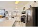 Bright kitchen featuring modern appliances and an outdoor view at 9557 Cabot Falls Ave, Las Vegas, NV 89149
