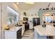 Bright kitchen featuring modern appliances, counter space and views to the dining area at 9557 Cabot Falls Ave, Las Vegas, NV 89149