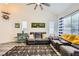 Bright living room with vaulted ceilings, luxury vinyl flooring, and modern nautical decor at 9557 Cabot Falls Ave, Las Vegas, NV 89149