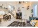Bright living room with vaulted ceilings, luxury vinyl flooring, and modern nautical decor at 9557 Cabot Falls Ave, Las Vegas, NV 89149