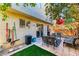 Enjoy this cozy outdoor space featuring a patio, artificial turf, and colorful, festive decorations at 9692 Waukegan Ave, Las Vegas, NV 89148