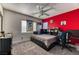 Cozy bedroom with bright walls, ample natural light, ceiling fan, and modern accents for relaxation and personalization at 9692 Waukegan Ave, Las Vegas, NV 89148