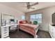 Bright bedroom with ample natural light, ceiling fan, and closet space for a comfortable living experience at 9692 Waukegan Ave, Las Vegas, NV 89148