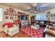 Cozy living room with hardwood floors, fireplace, and large windows for natural light at 9692 Waukegan Ave, Las Vegas, NV 89148