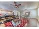 Open concept living room featuring a cozy seating area, dining space, and kitchen at 9692 Waukegan Ave, Las Vegas, NV 89148