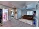 Spacious living room with neutral walls, a ceiling fan, and seamless access to other parts of the home at 9692 Waukegan Ave, Las Vegas, NV 89148