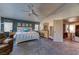 Large main bedroom with plush carpeting, neutral tones, and abundant closet space at 9692 Waukegan Ave, Las Vegas, NV 89148