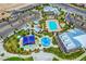 Aerial view of community amenities showcasing a large pool, splash pad, playground, and clubhouse at 9993 Birch Knoll Ave, Las Vegas, NV 89166