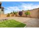 Home backyard featuring gravel landscaping, turf area, brick wall and immature shade trees at 9993 Birch Knoll Ave, Las Vegas, NV 89166