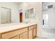 Well-lit bathroom featuring a sink, mirror, and toilet next to bright tile flooring at 9993 Birch Knoll Ave, Las Vegas, NV 89166