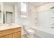 Bright bathroom featuring a shower-tub combo, sink, toilet, and tile flooring at 9993 Birch Knoll Ave, Las Vegas, NV 89166