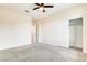Open bedroom showcasing carpeted floors, bright walls, closet, and ceiling fan at 9993 Birch Knoll Ave, Las Vegas, NV 89166