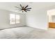 Bright bedroom with large window and neutral colored carpet at 9993 Birch Knoll Ave, Las Vegas, NV 89166