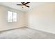Bedroom with plush carpeting, neutral color palette, and natural light from a window at 9993 Birch Knoll Ave, Las Vegas, NV 89166