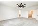 Spacious bedroom with ensuite bathroom and large ceiling fan at 9993 Birch Knoll Ave, Las Vegas, NV 89166