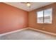 Bedroom featuring a window, neutral walls, plush carpeting, and ample space at 9993 Birch Knoll Ave, Las Vegas, NV 89166